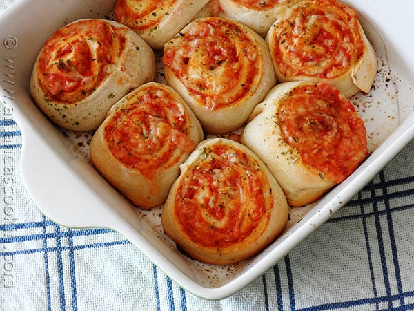 A close up photo of pizza roll ups.