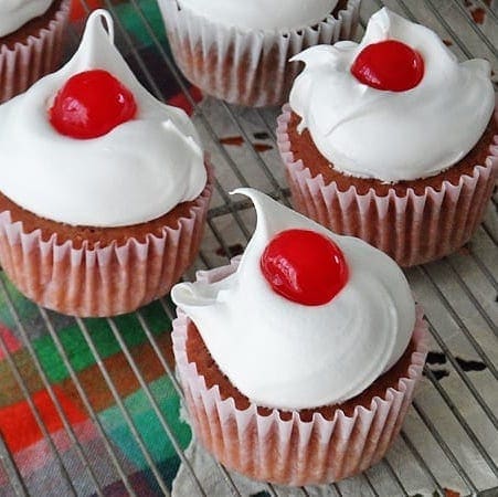 A close up photo of three ingredient cherry cupcakes.