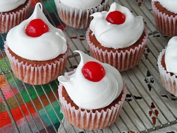 A close up photo of three ingredient cherry cupcakes.