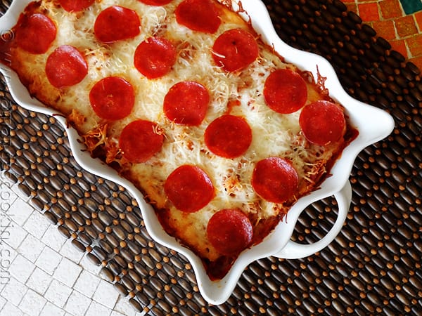 An overhead photo of a sausage and pepperoni pizza casserole.