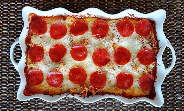 An overhead photo of a sausage and pepperoni pizza casserole.