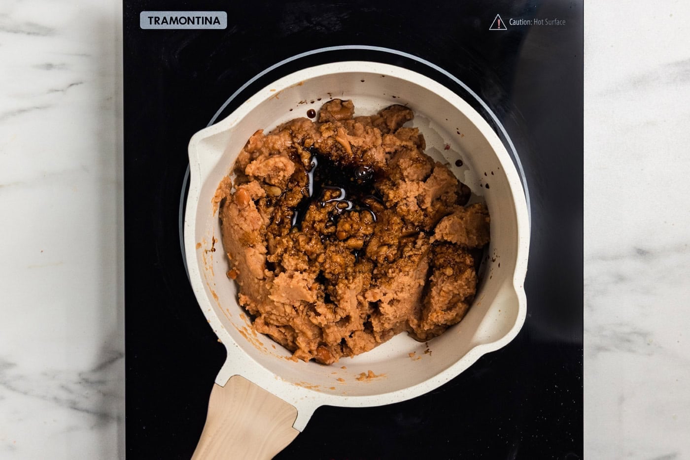refried beans in saucepan