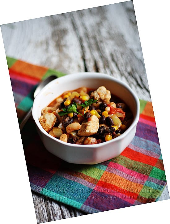 A bowl of chicken chili with black beans and corn.