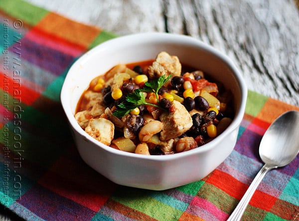 A bowl of chicken chili with black beans and corn.