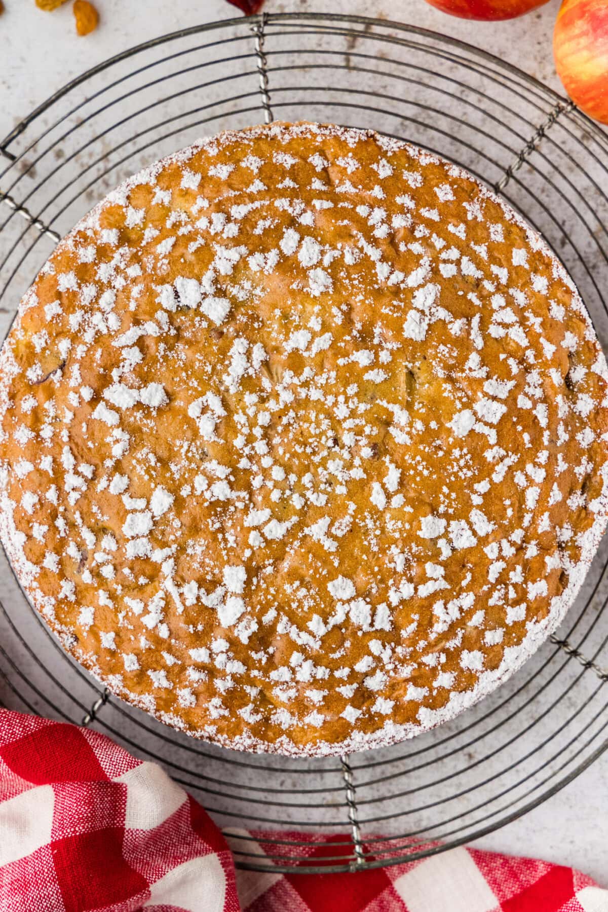 overhead view of Merryfield Apple Cake with doily decoration