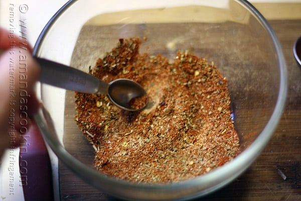 A close up photo of a clear bowl of seasoning. 