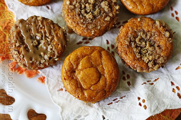 A close up overhead photo of pumpkin mini cakes with cinnamon streusel topping.