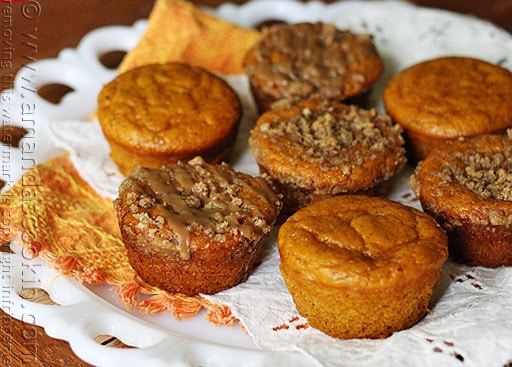 A plate of pumpkin mini cakes with cinnamon streusel topping.