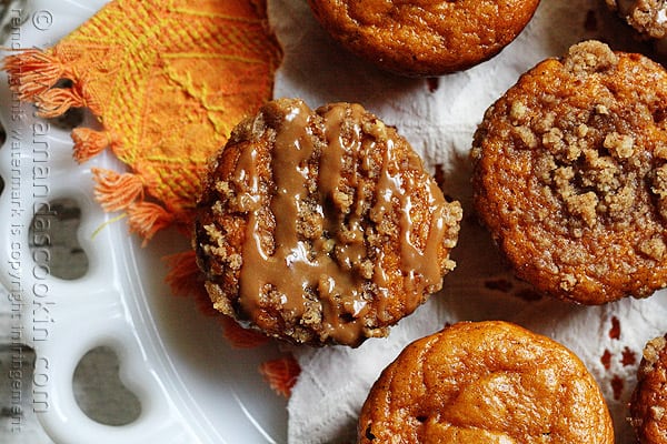 A close up overhead photo of pumpkin mini cakes with cinnamon streusel topping.