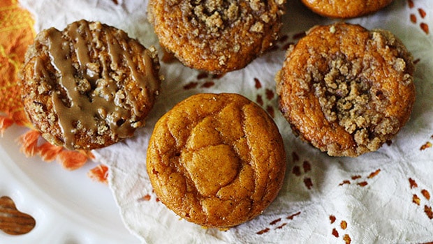 A close up overhead photo of pumpkin mini cakes with cinnamon streusel topping.