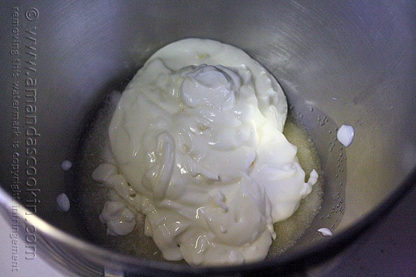 A photo of oil, Truvia and Yoplait Greek yogurt in a mixing bowl.