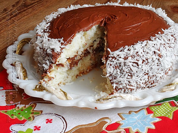 A close up photo of an almond joy coconut snowflake cake.