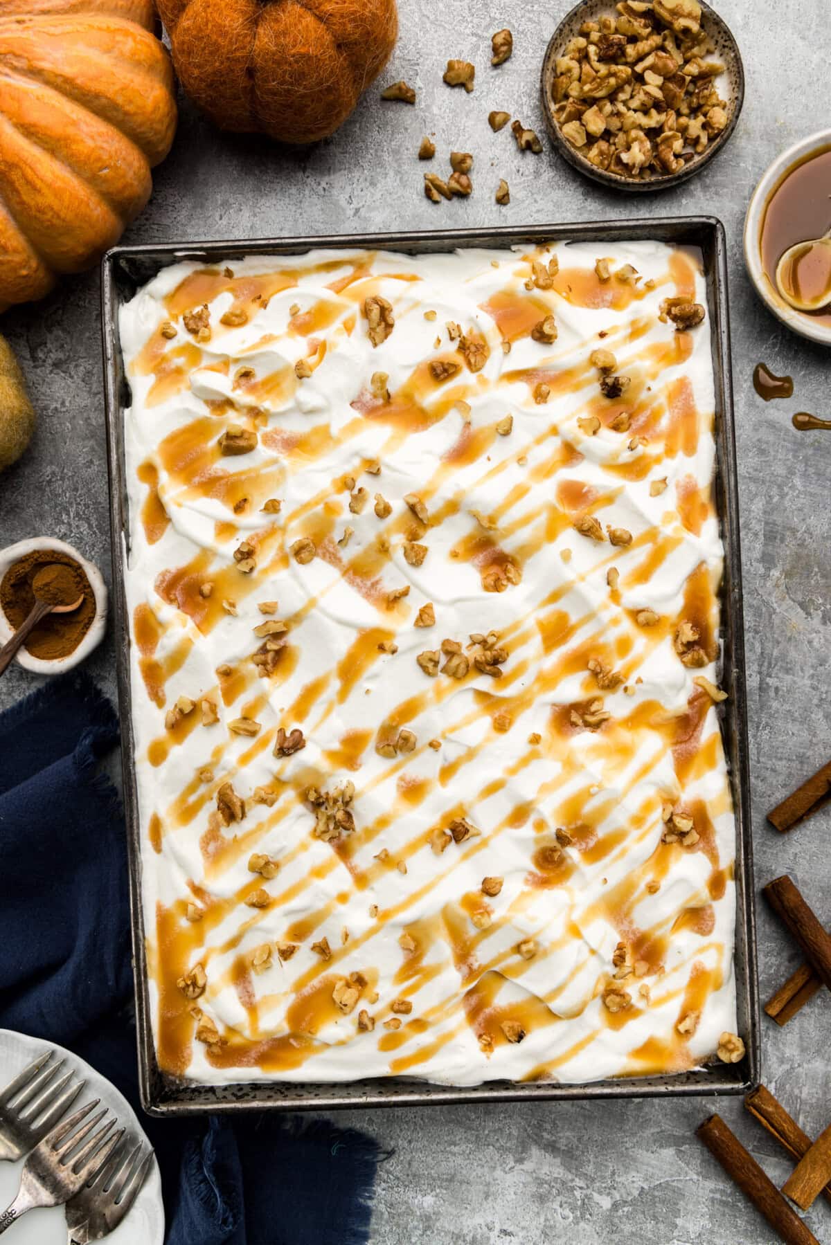 overhead view unsliced pumpkin pudding poke cake