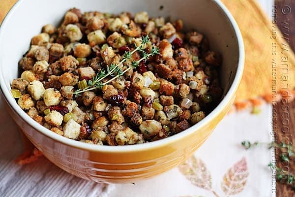 A bowl of stuffing with parsley, sage, rosemary and thyme.