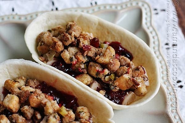 A close up photo of a turkey, cranberry and stuffing pockets.