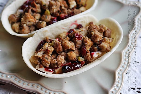A close up photo of turkey, cranberry and stuffing pockets.