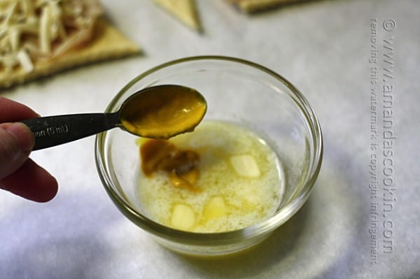 adding mustard to melted butter