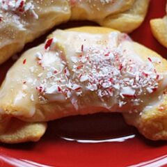 A close up of a white chocolate candy cane crescent.