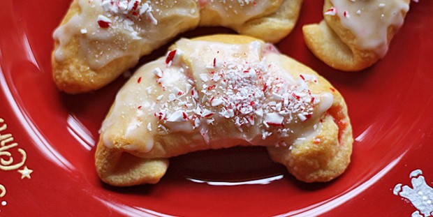 A close up of a white chocolate candy cane crescent.