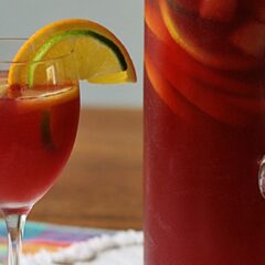 A close up photo of a pitcher and glass filled with Mexican inspired sangria.