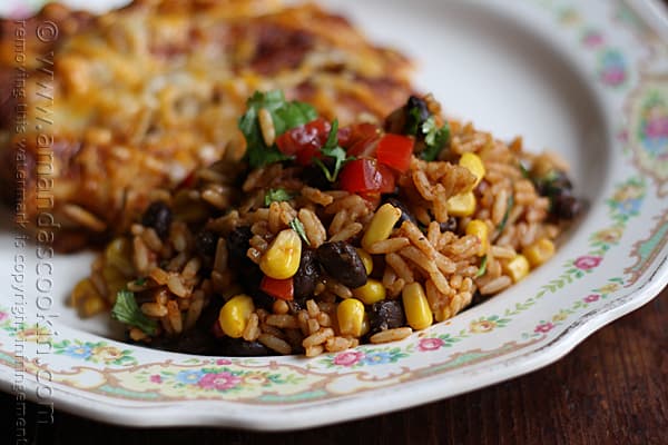 A close up photo of Spanish rice with black beans and corn.