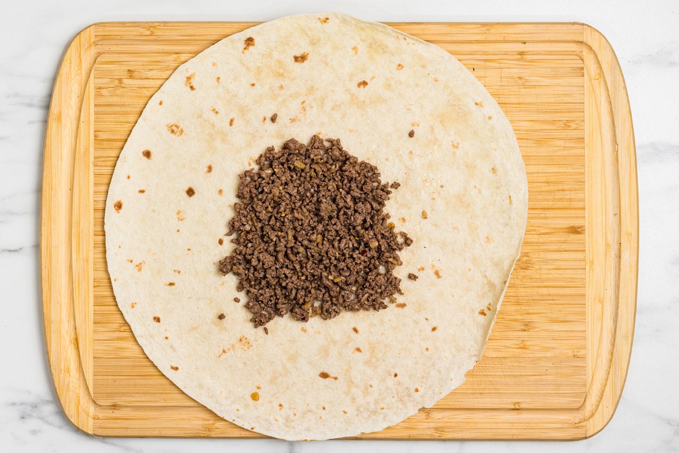ground beef in center of tortilla