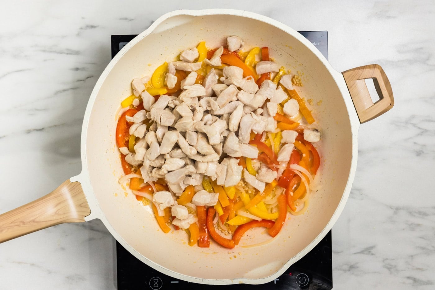 chicken and pepper in skillet