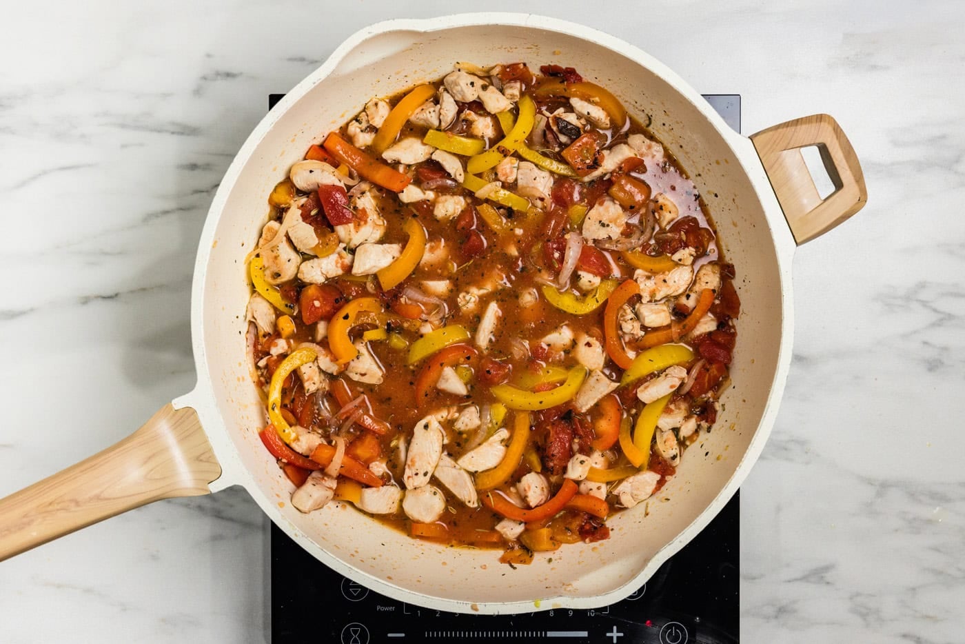 sauce with peppers in skille