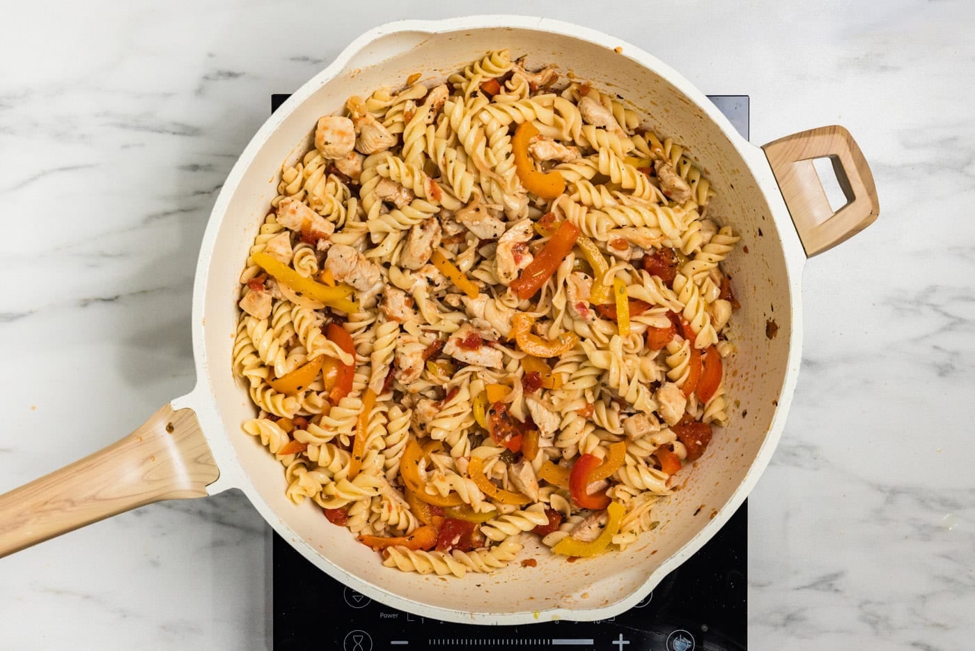chicken and peppers pasta in skillet