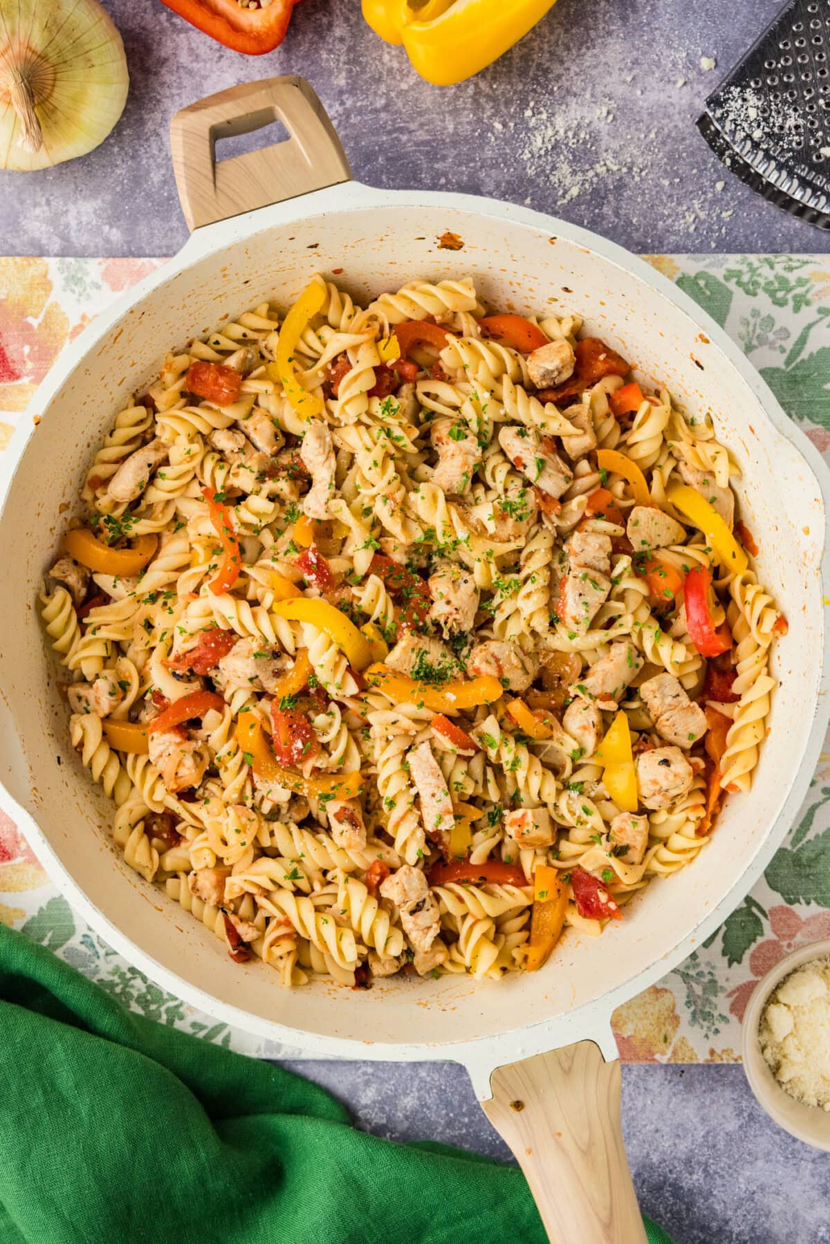 overhead of chicken and peppers pasta in skillet