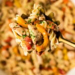 serving spoon of chicken and peppers pasta