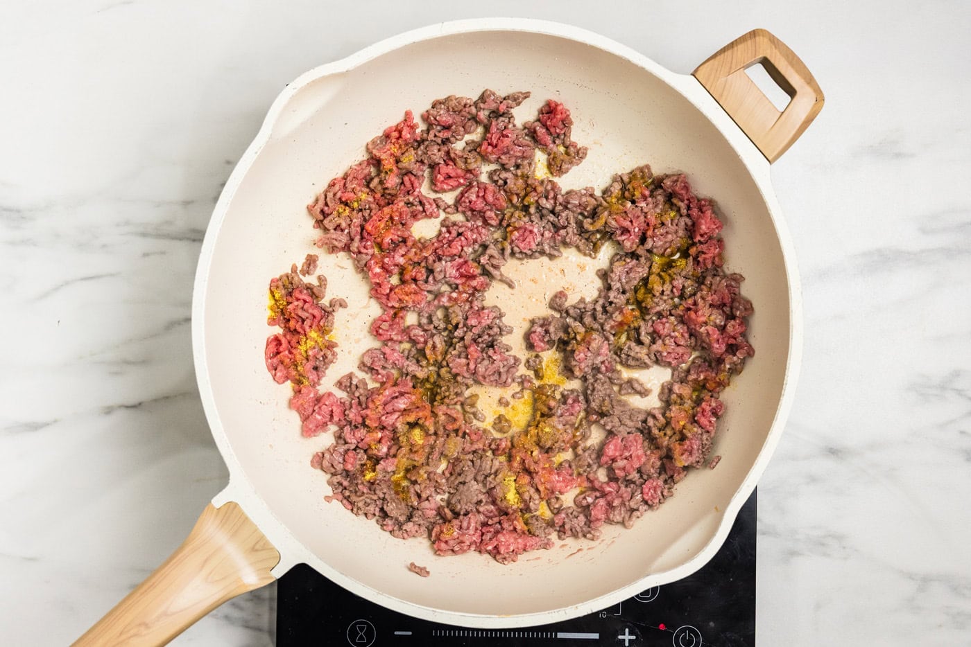 browing ground beef in a skillet