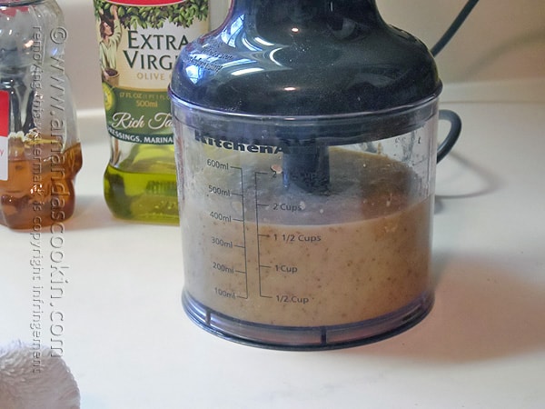 A photo of the dressing ingredients blended in a food processor. 