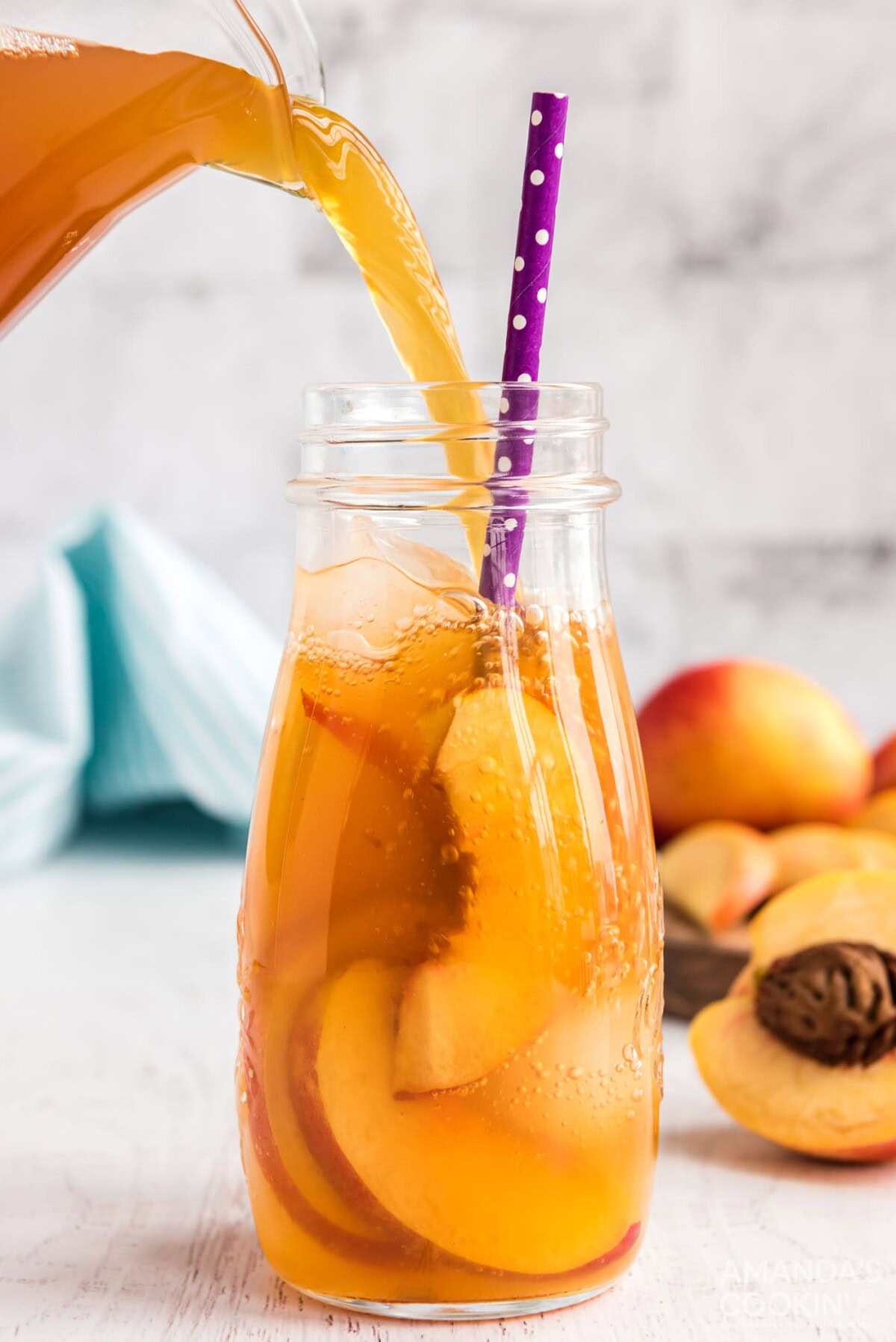 pouring peach tea