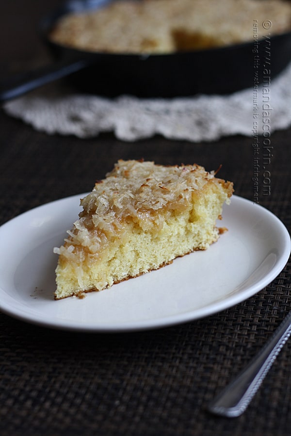 A slice of lazy daisy cake on a white plate.