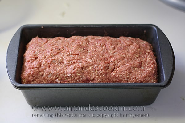 A photo of unbaked Quaker oats meatloaf in loaf pan.