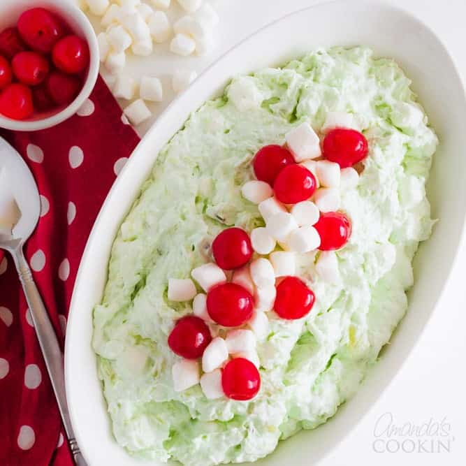 watergate salad in a serving with garnished with marshmallows and cherries