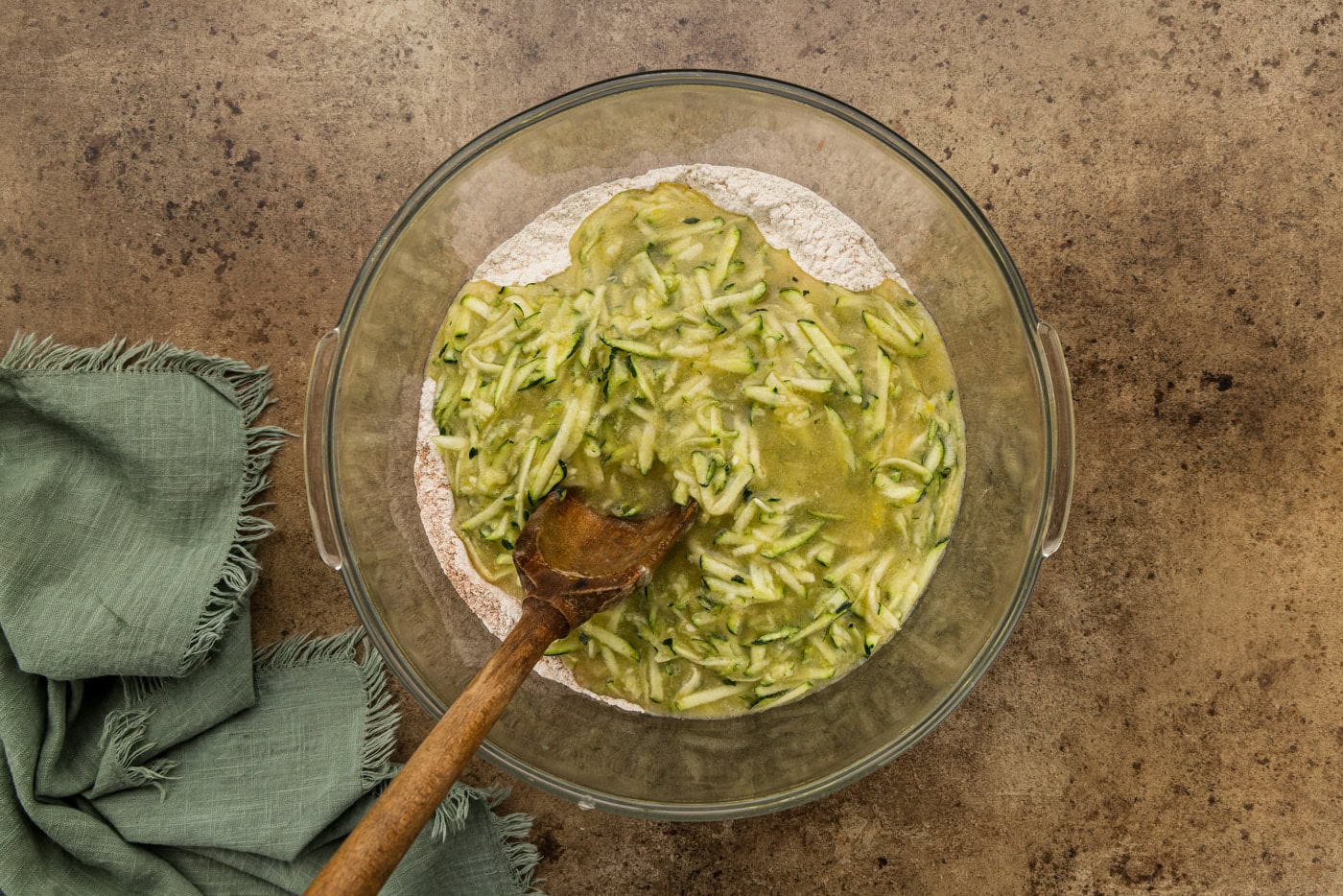 shredded zucchini in bowl with batter