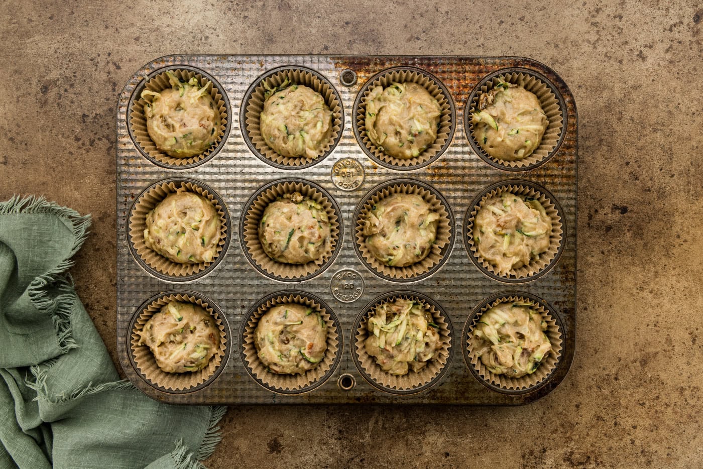 Vanilla Zucchini Muffin batter in muffin tim