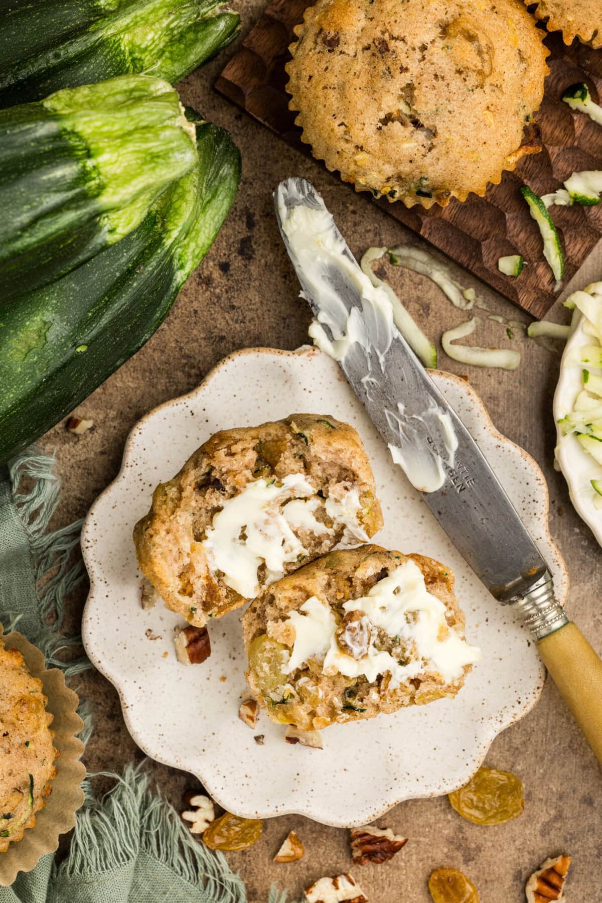Vanilla Zucchini Muffin with butter spread on it
