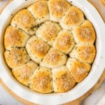 meatball stuffed biscuits in a white pie pan