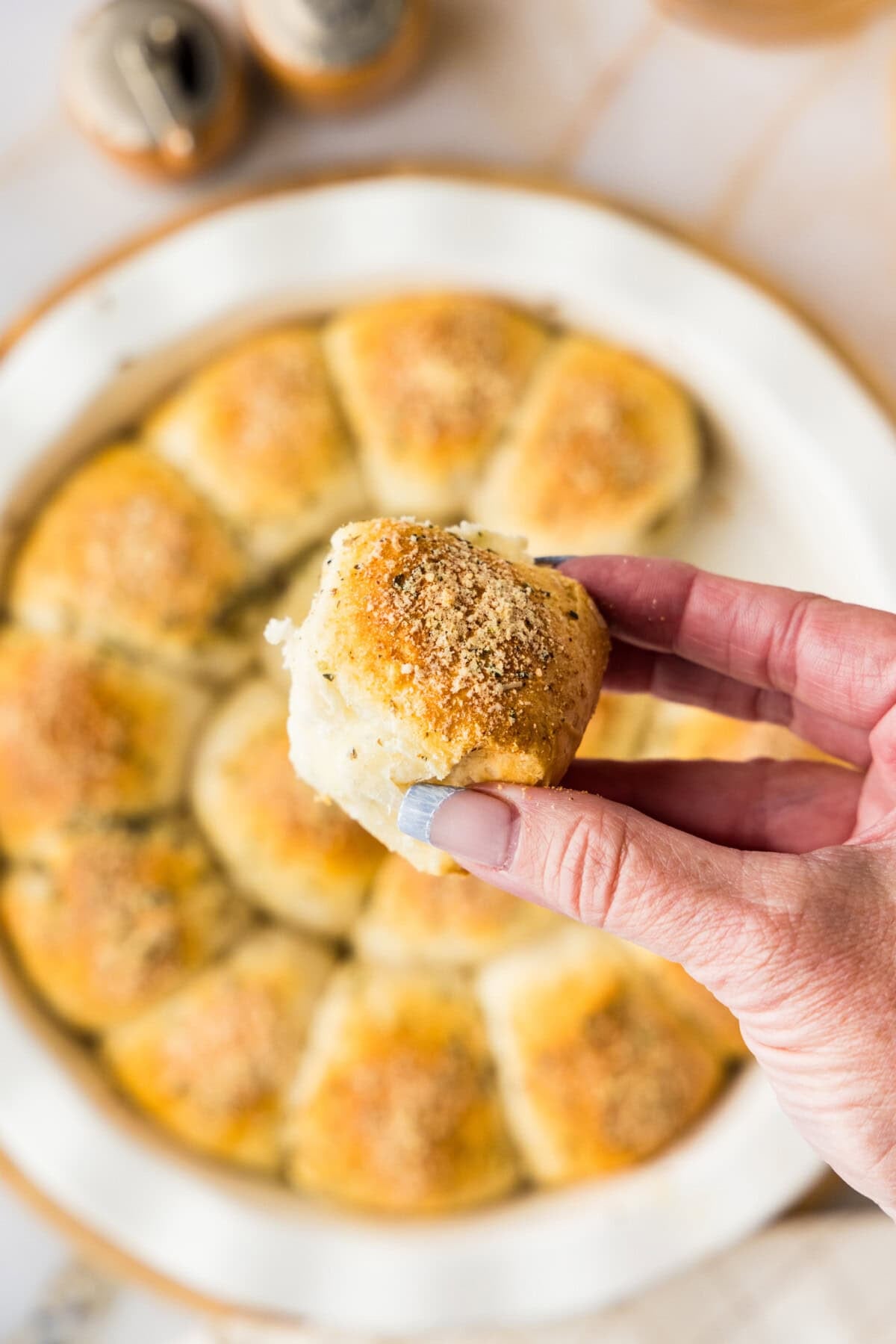 hand holding a meatball stuffed biscuit