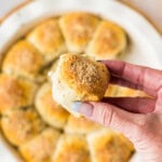 hand holding a meatball stuffed biscuit