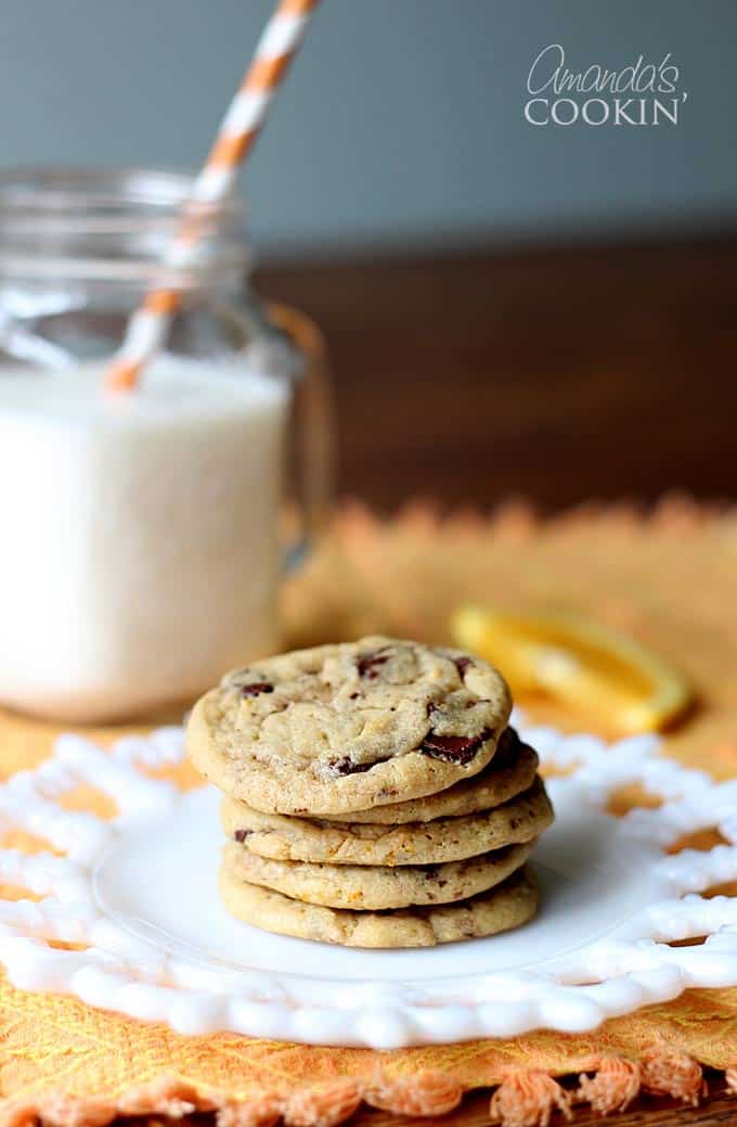 A photo a stack of orange chocolate chip cookies.