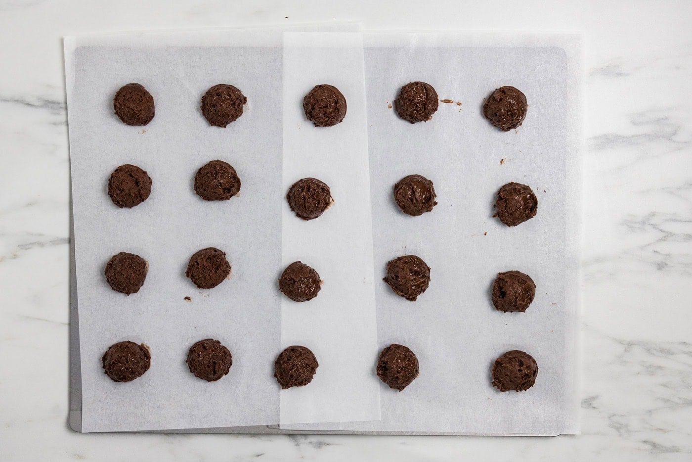 brownie dough balls on baking sheet