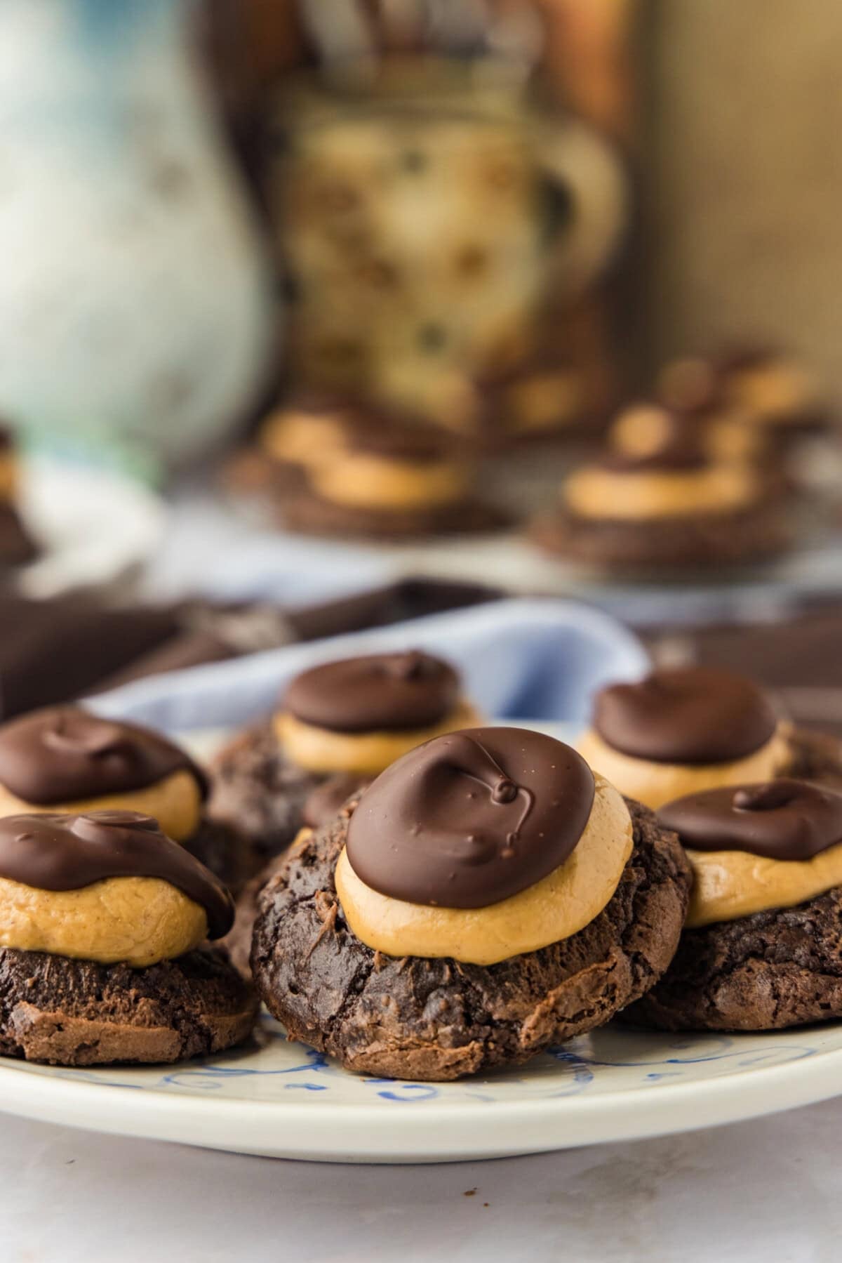 close up of buckeye brownie cookies on a white plate
