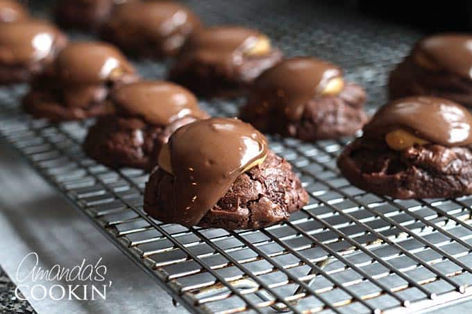 A close up photo of a buckeye brownie cookies on a cooling rack.