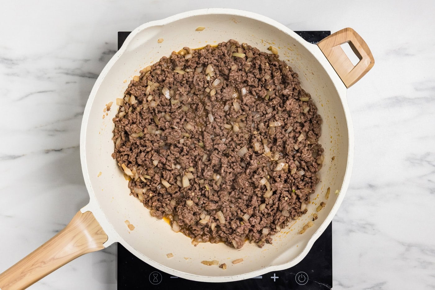 cooked ground beef in skillet