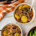 overhead view of two bowls of Slow Cooker Cowboy Casserole