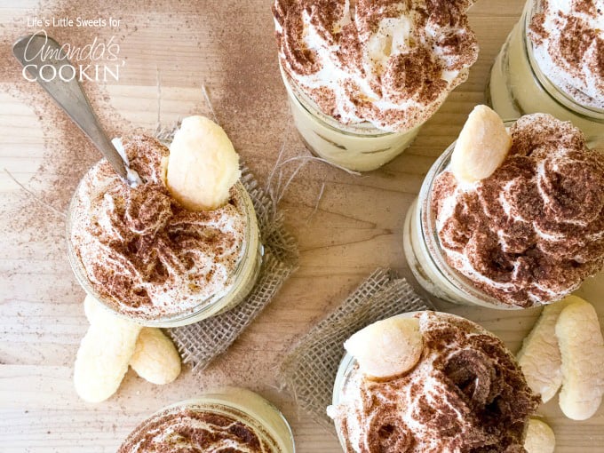 An overhead photo of tiramisu trifles in mason jars.